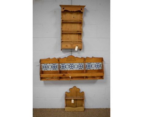 20th C oak wall mounted shelf, formed of three divisions, the back with inset blue and white ceramic tiles; and two other wal