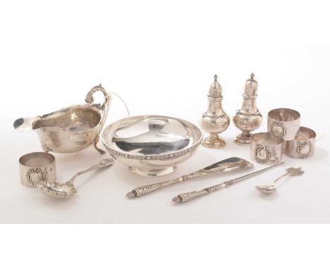 Items of George V and later silver and white metal: including; a set of four napkin rings, London, 1910; a sauce boat, Cheste