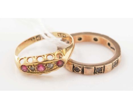 A ruby and diamond ring on 18ct gold, and a 9ct gold eternity ring, 4.4g gross.