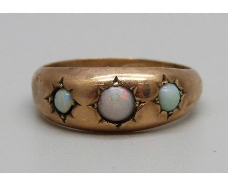 A 9ct gold and three stone opal ring, 1.3g, M 