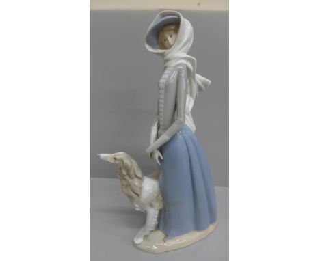 A Lladro figure of a girl with Borzoi 
