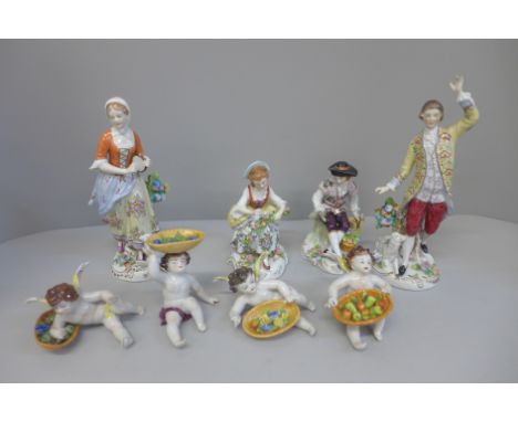 A group of Sitzendorf figures, two pairs and four cherubs each with a basket of fruit 