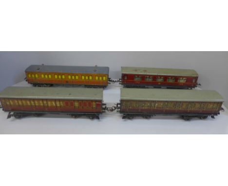 Three Hornby O gauge LMS carriages and one Hornby O gauge Metropolitan carriage