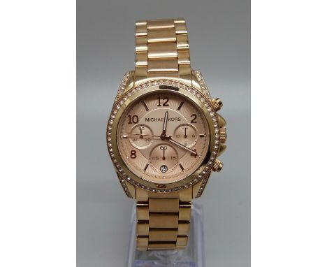 A Michael Kors rose gold chronograph wristwatch 