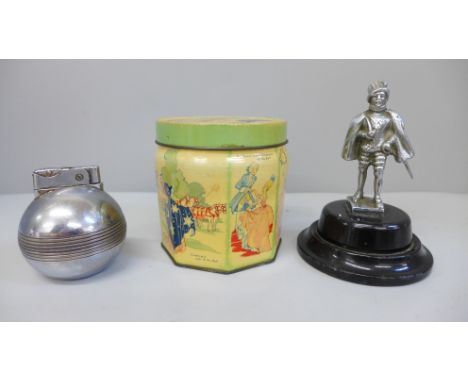 A silver plated model of Sir Walter Raleigh, a table lighter and a Cinderella toffee tin