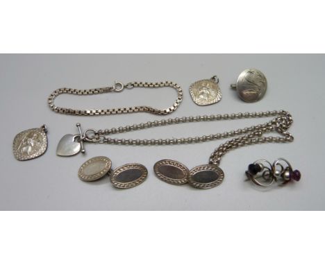 Two Georg Jensen pendants, a pair of silver cufflinks, a Charles Horner silver brooch, a silver chain and a bracelet 