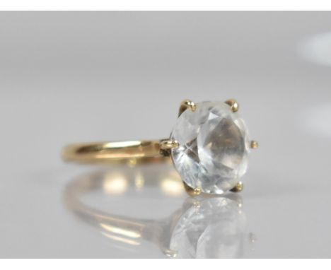 A 9ct Gold Mounted White Sapphire Solitaire Ring, Round Cut Stone Measuring 10.3mm Diameter, Supported by Six Yellow Metal Cl