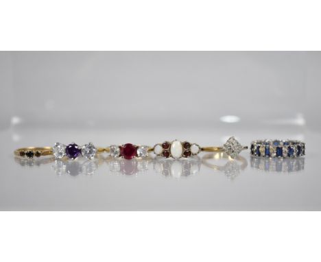 A Collection of Various Rings to include 9ct Gold and Smokey Quartz Trilogy Ring, a Blue and White Sapphire Eternity Ring (Mi