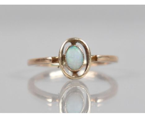 An Early 20th Century 9ct Rose Gold and Opal Ring, Central Oval Cabochon Opal Measuring 4.6mm by 3.6mm, Collet Set in an Oval