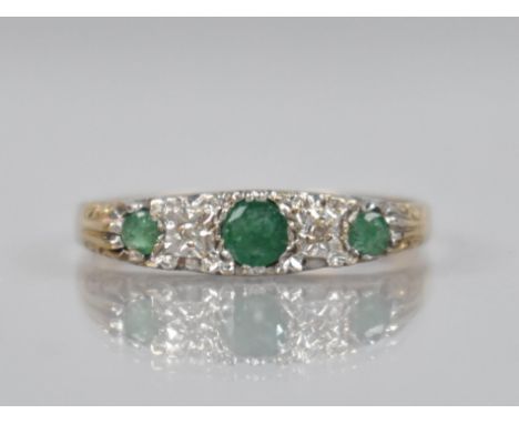 An Emerald and Diamond Five Stone Boat Ring, Central  Mixed Cut Emerald Measuring 18.7mm by 17mm in White Metal and Flanked b