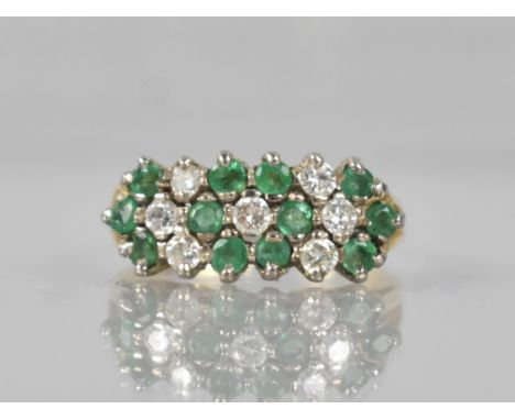 An 18ct Gold, Emerald and Diamond Cluster Ring Comprising Seven Claw Set Round Brilliant Cut Diamonds, Each Approx 2.5mm Diam