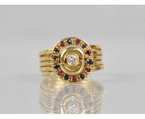 An 18ct Gold, Diamond, Ruby and Sapphire Dress Ring, Comprising Five Bound Bands, Central with Round Cut Diamond Measuring Ap