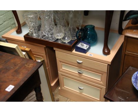 PAir of light beech and cream modern bedside chests with glass tops 