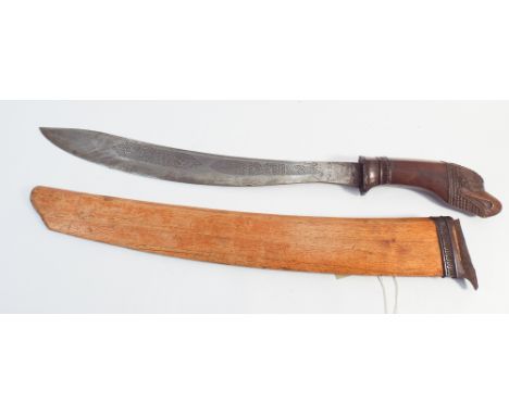 Malayan short sword with hardwood carved handle, carved as an eagles head in a wooden scabbard 