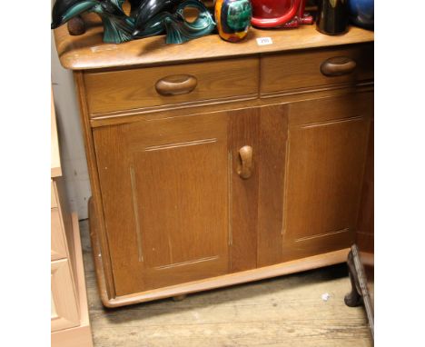 6' Ercol honey oak low sideboard fitted four cupboards and drawers 