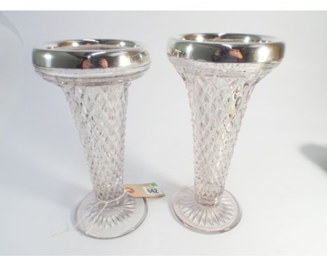 Near pair of cut glass trumpet shaped flower vases with hallmarked silver rims Birmingham hallmarks, the tallest measuring 25