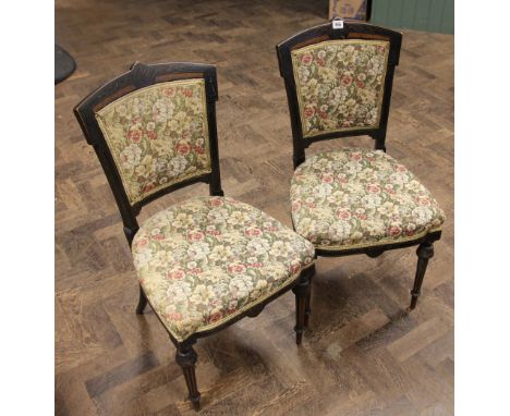 Pair of Edwardian ebonised occasional chairs with tapestry upholstered seats and backs