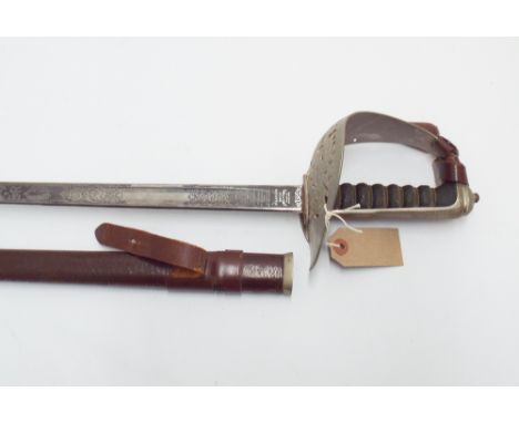 Elizabeth II officers sword complete with its brown leather scabbard and leather knot 