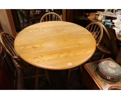 Ercol light wood drop leaf dining table