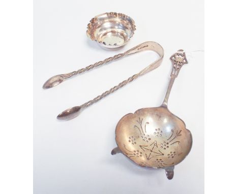 Hallmarked silver tea strainer, sugar nips and a small bowl 