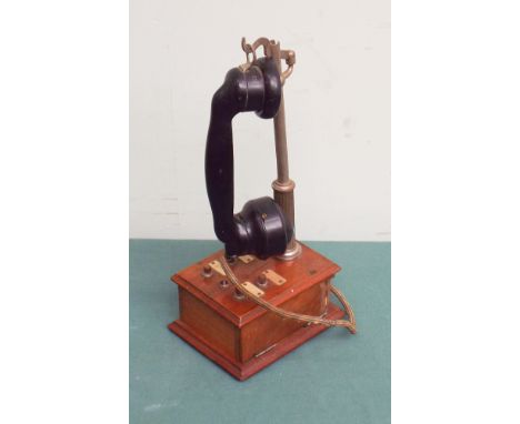 French stick style telephone on mahogany base 