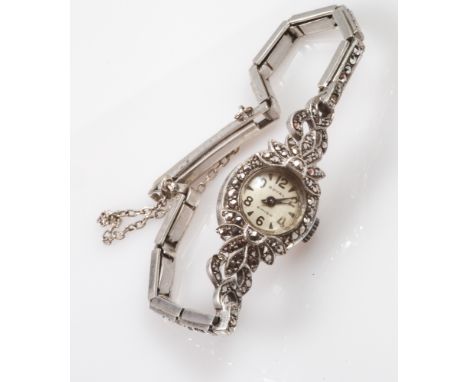 Vintage ladies silver cocktail watch set with marcasites. On flexi strap with safety chain fastening.