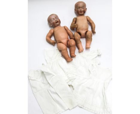 Two Kammer & Reinhardt bisque head male dolls - head number 525/6 with composition bodies, with a few items of vintage clothi