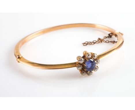 Victorian gold, sapphire and diamond ladies hinged bangle, set with a circular claw set sapphire surrounded by 8 brilliant cu