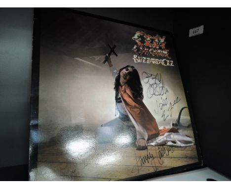 A copy of Ozzy Osbourne Blizzard of Oz signed by Ozzy and band a genuine item with true provenance.