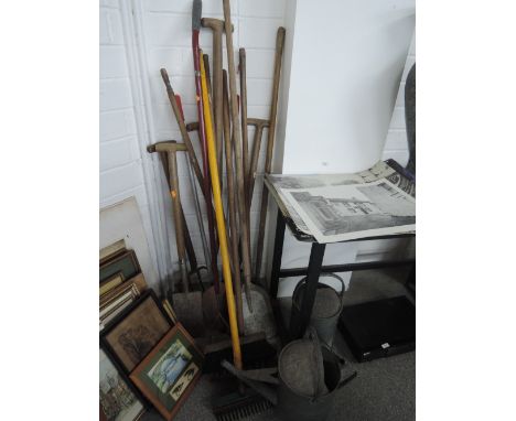 A selection of garden hand tools and two galvanised watering cans
