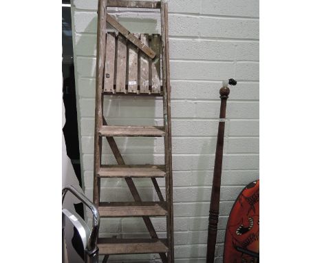 A set of vintage wooden step ladders