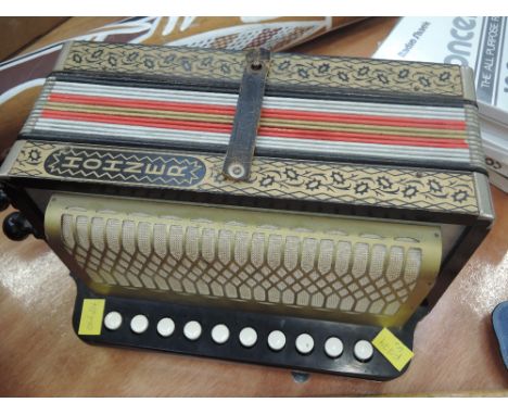 A vintage Hohner one row button accordion