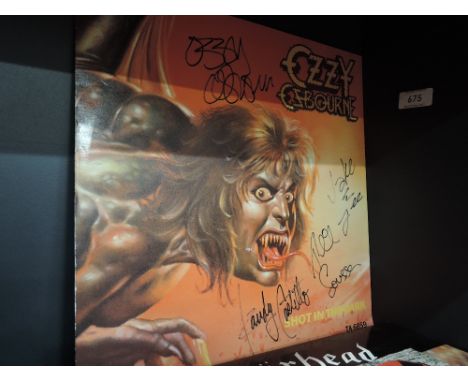 A copy of Ozzy Osbourne Shot in The Dark single signed by Ozzy and band a genuine item with true provenance.