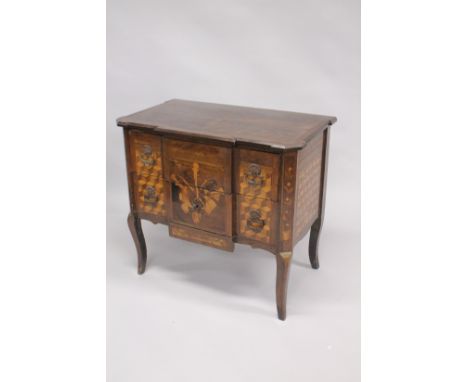 AN 18TH CENTURY FRENCH BREAKFRONT WALNUT AND MARQUETRY COMMODE, with two deep drawers, inlaid with musical trophies, the side
