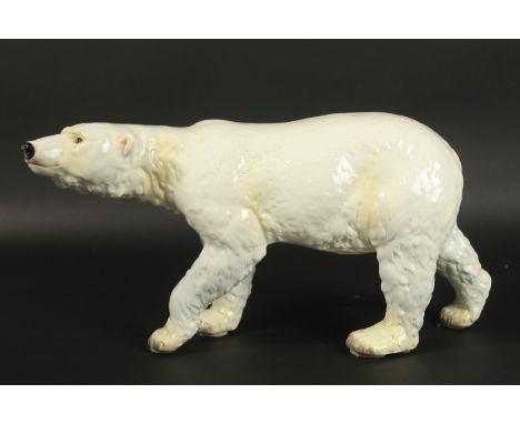 GOEBEL W GERMANY. A LARGE WHITE POTTERY STANDING POLAR BEAR. Printed mark.  46cms long x 23cms high.