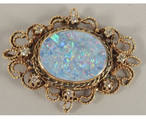 A DIAMOND AND OPAL BROOCH.