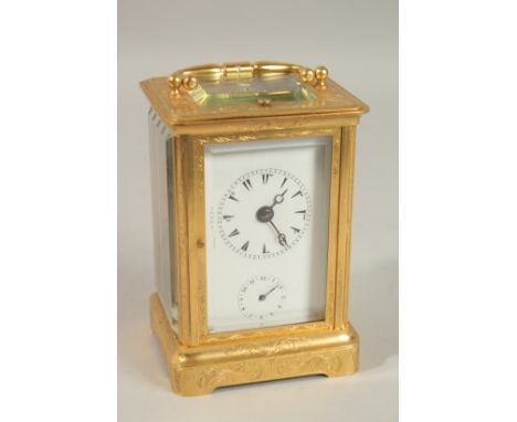A VERY GOOD 19TH CENTURY FRENCH REPEATER BRASS CARRIAGE CLOCK with alarm, in an engraved case. 14.5cms high.