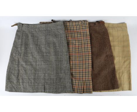 DAKS Four ladies 1980s vintage tweed and wool skirts. One in grey Prince of Wales check (Simpsons of Piccadilly). One classic