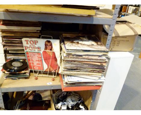 Shelf of mixed LP and single records including Madonna and Top Of The Pops