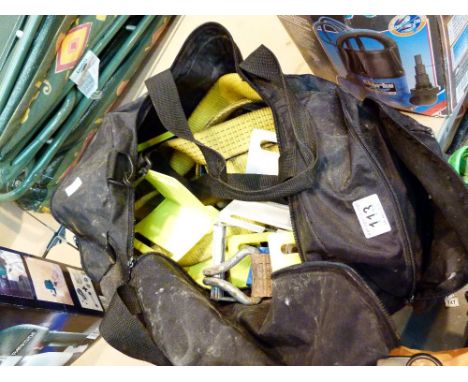 Bag of vehicle tie down straps and ratchets