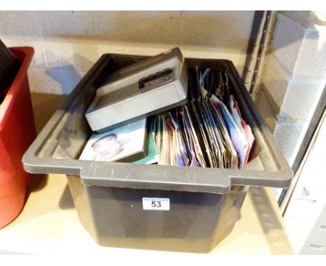 Box of mixed single records and a retro reel to reel tape recorder