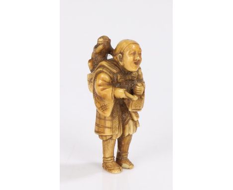 Japanese Edo period ivory netsuke, appears to be signed Tomotada, Kyoto school, carved as a standing figure with a monkey rai