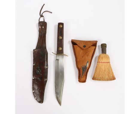 Solingen Germany bowie knife, the steel blade with a rivetted mahogany grip housed within the leather scabbard, together with