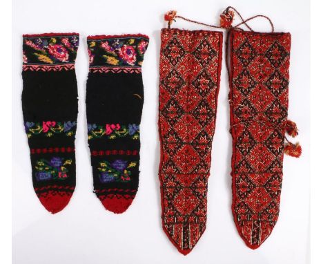 Two pairs of Greek sock boots, the first woollen pair in red with a geometric design, the second pair in black with bright fo