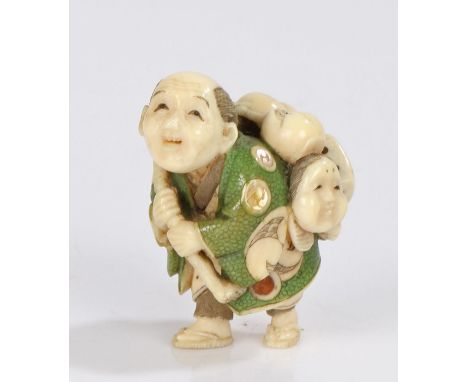 Japanese Tokyo School Meiji period ivory netsuke, By Yasutomo (Hoyu), signed Yasutomo, the male figure hunched over carrying 