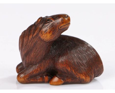 Japanese wood Netsuke of a horse, by Sari, Iwashiro Province, 19th century, signed in an oval to the base Sari. The horse rec