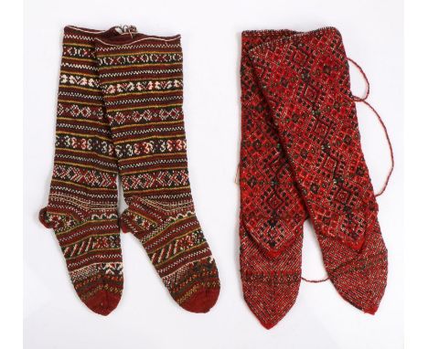 Two pairs of Greek sock boots, the first with a geometric line design, the second pair with  diamond design on red. Provenanc