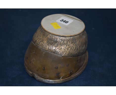 An early 20th Century horse hoof inkwell with plated mounts.