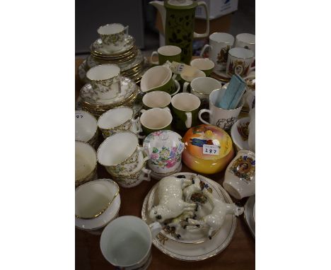 A Crown Devon coffee set in green glaze with floral decoration; an early 20th Century part tea service; commemorative ware; B