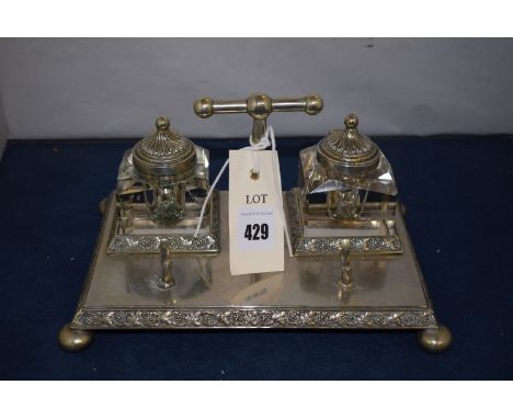 A silver plated inkstand by Karanti, with cut-glass inkwell.